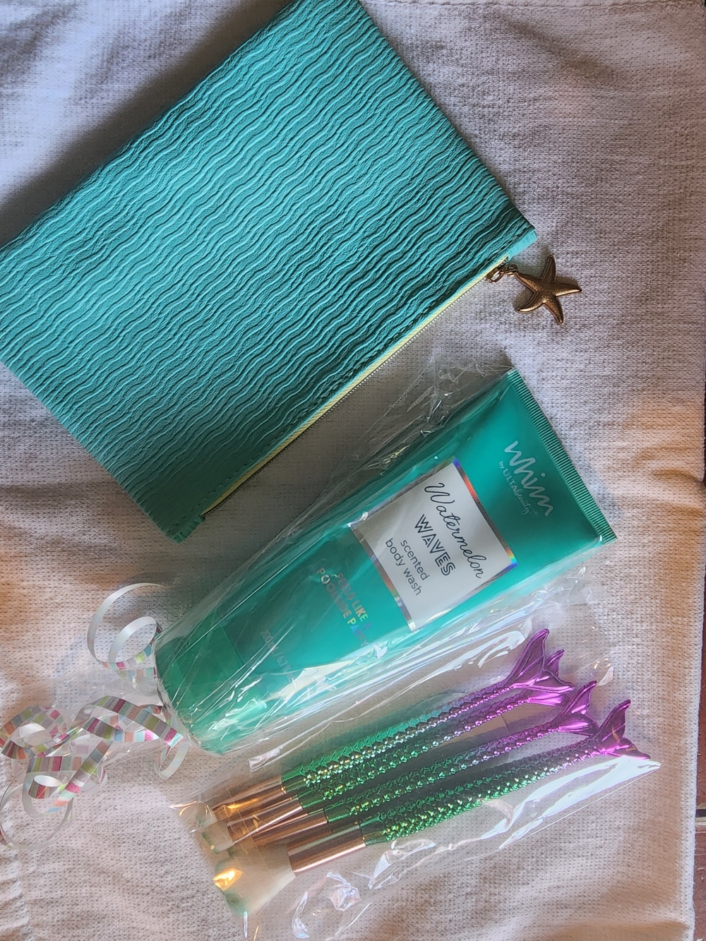 Beach Beauty. Ulta Watermelon Waves Body Wash, Ipsy Pouch, Mermaid Brushes.